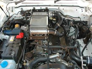CROWDED HOUSE: The engine compartment of the Nissan Patrol Pickup. The intercooler is the small square object at the centre.