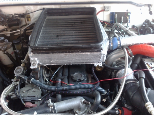 check the size of that intercooler...... and there is a fan connected to a thermo switch under the intercooler