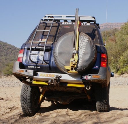 High lift jack on spare wheel. Easily accessed and removed.