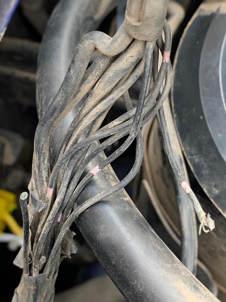 Earth point behind Passenger side Headlight