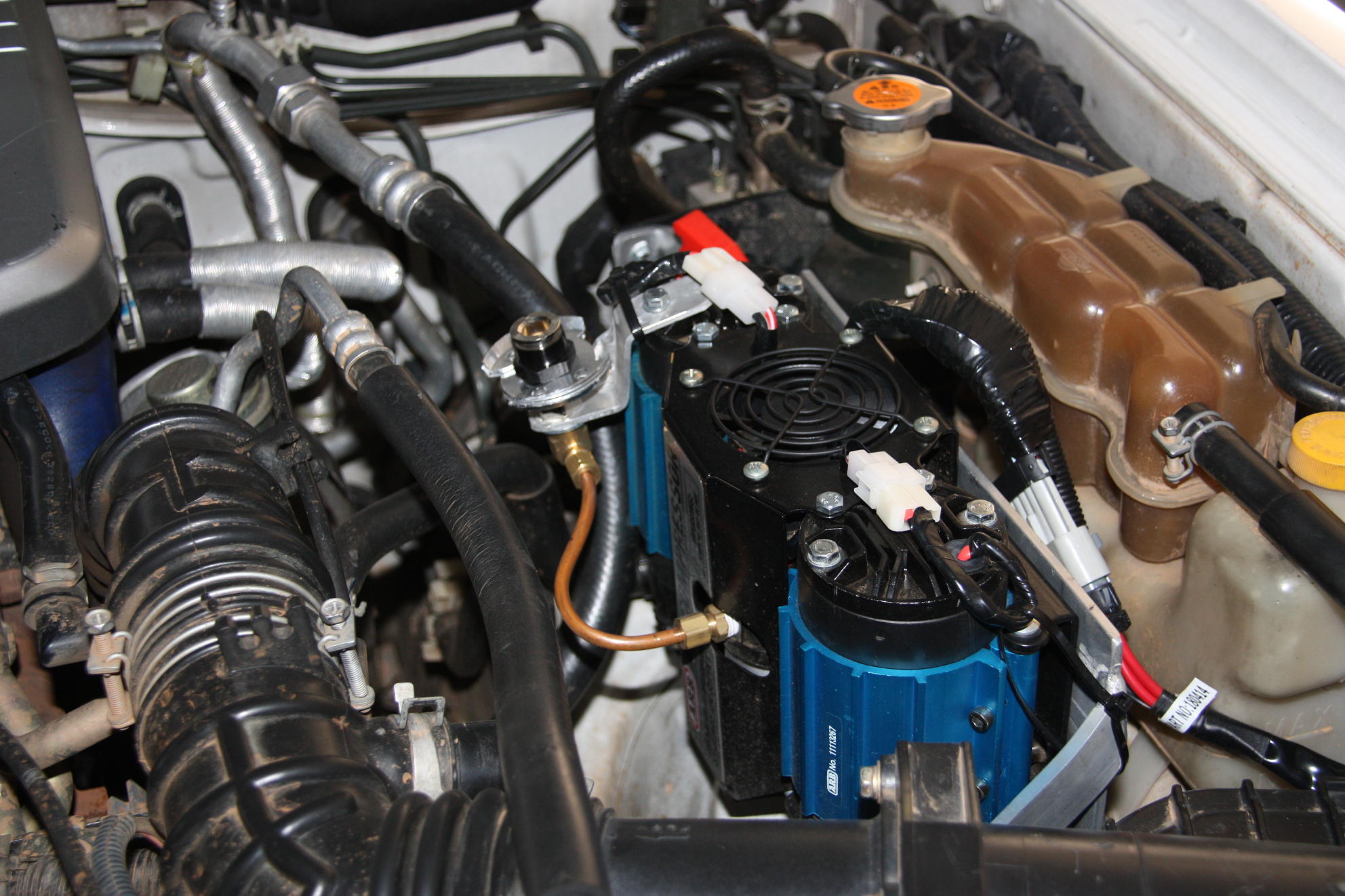 Compressor in engine bay.