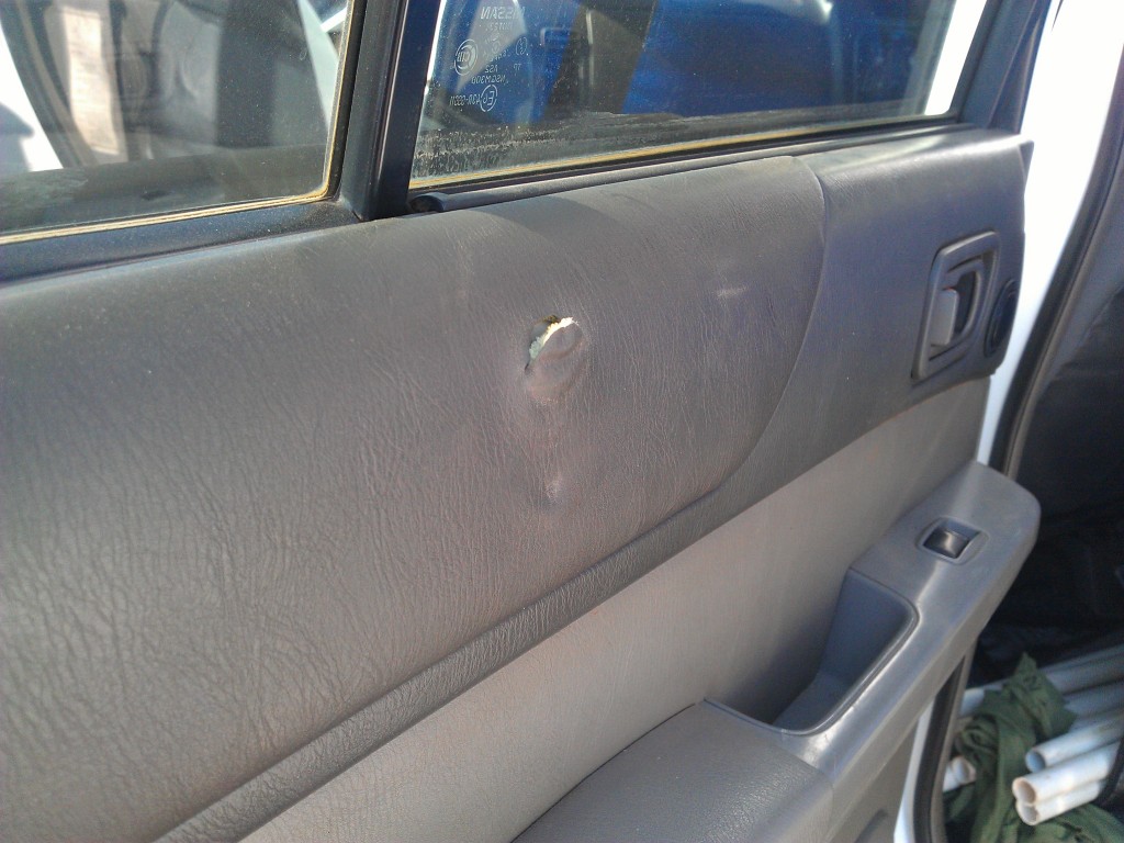 Torn door panel