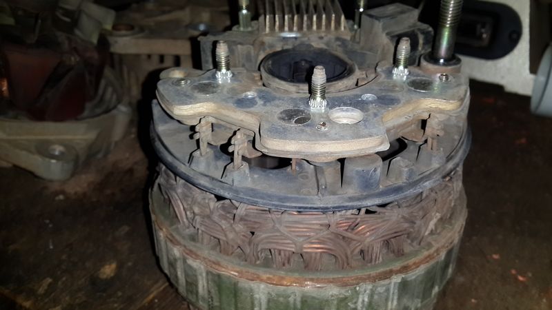 Hitachi Alternator showing diodes and rectifiers from side, including connection to stator